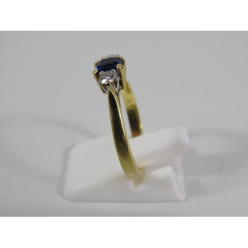 151 - 18ct Gold Ring set with a 4mm by 5mm Sapphire and two 1/16 carat diamonds, finger size 