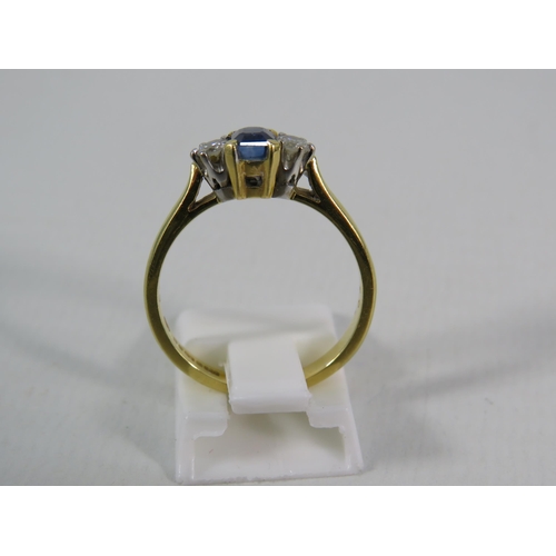 151 - 18ct Gold Ring set with a 4mm by 5mm Sapphire and two 1/16 carat diamonds, finger size 