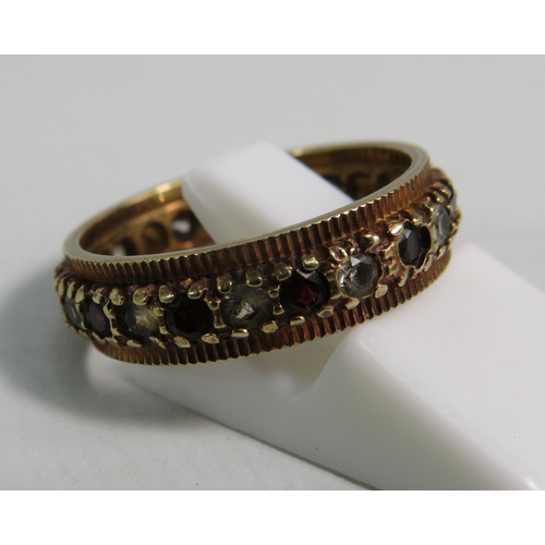 160 - 9ct Gold Garnet and clear stone eternity ring, finger size 