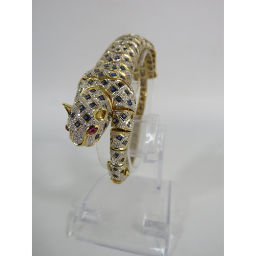 171 - 18ct gold articulating panther bracelet / brooch set with 1.34 cts of Diamonds, 4.84cts of Sapphires... 