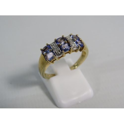 173 - 9ct Yellow Gold Tanzanite and Moissanite ring, Finger size 