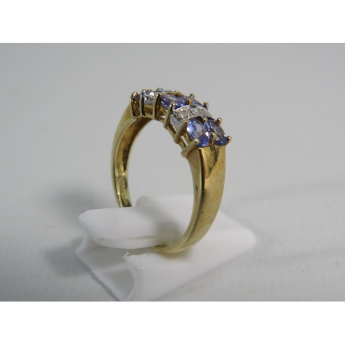 173 - 9ct Yellow Gold Tanzanite and Moissanite ring, Finger size 