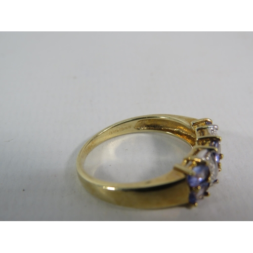 173 - 9ct Yellow Gold Tanzanite and Moissanite ring, Finger size 