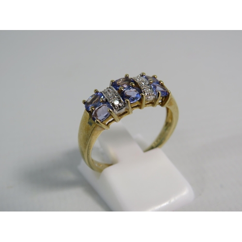 173 - 9ct Yellow Gold Tanzanite and Moissanite ring, Finger size 