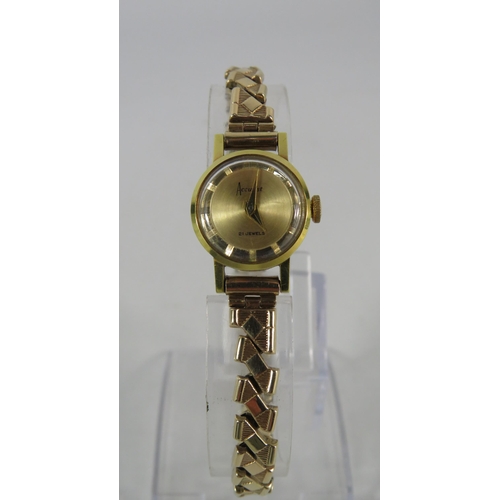 194 - Ladies Accurist 21 jewel mechanical wristwatch with 9ct gold expanding strap. In running order.