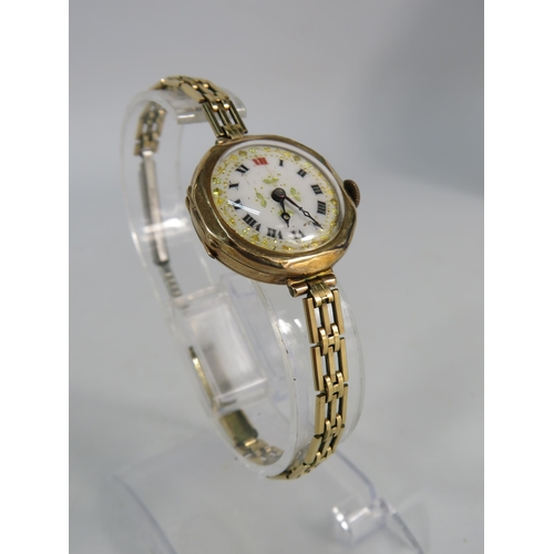 196 - Vintage ladies 9ct gold enamel face wristwatch with rolled gold strap, in running order.