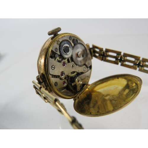 196 - Vintage ladies 9ct gold enamel face wristwatch with rolled gold strap, in running order.