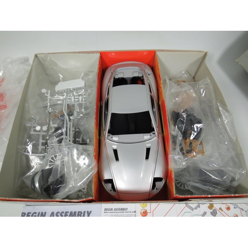 801 - Die Cast Model Kit of a 2002 Aston Martin V12 Vanquish which appears to be complete and in original ... 