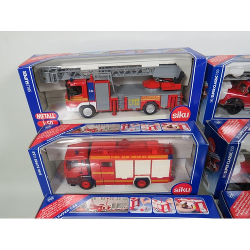 812 - Seven Siku 1:50 Scale Die Cast Scale Models of Fire Trucks plus two by Corgi classics . All in boxed... 