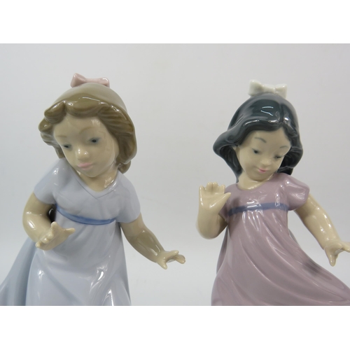 304 - Two Nao figurines of young girls with dogs, 6.5