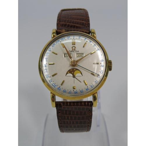 313 - 1944 Omega Cosmic triple date moonphase 18ct gold gents wristwatch, with receipts from 1989. Case No... 