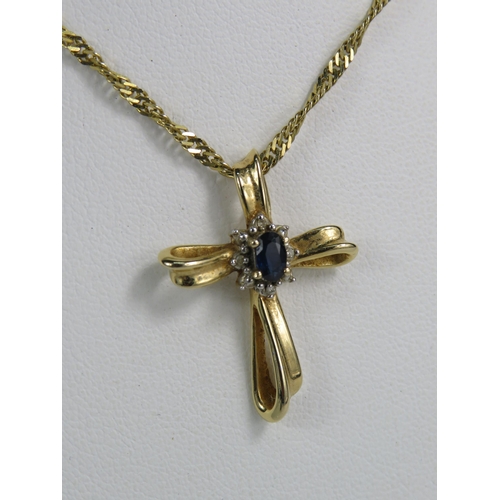 322 - 14ct gold crucifix set with a oval sapphire and diamonds on a 16