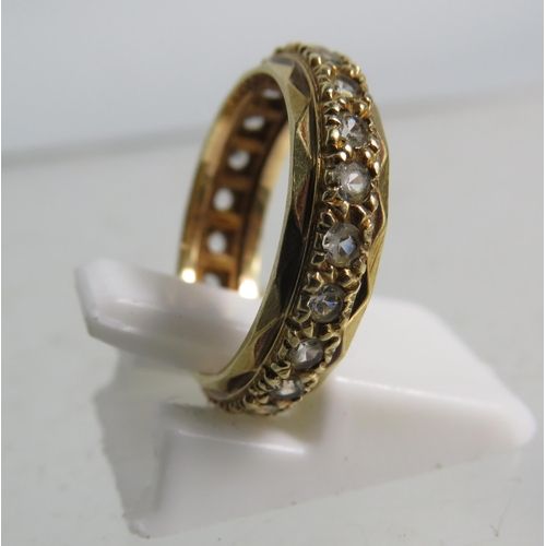 323 - 9ct gold eternity ring set with clear topaz stones, finger size 