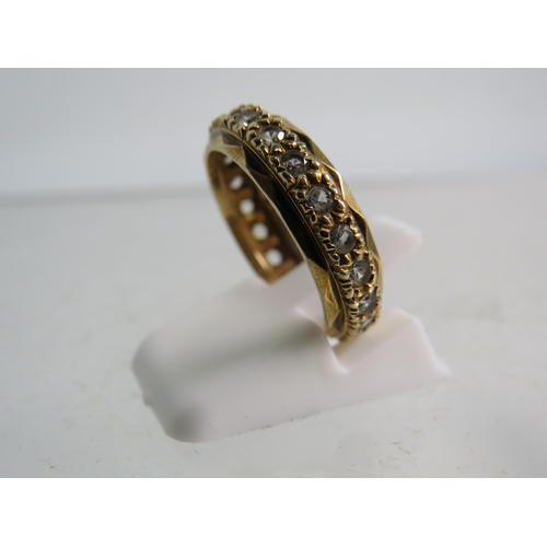 323 - 9ct gold eternity ring set with clear topaz stones, finger size 