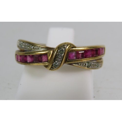 326 - 9ct Rose gold Ruby and diamond crossover ring, finger size 