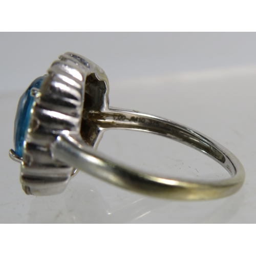 327 - 9ct White gold ring set with a large blue topaz 8mm by 8mm which is surrounded by approx 1 cts of Di... 