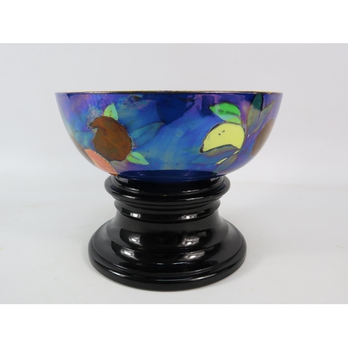 683 - Rare Carltonware orchard pattern lustre bowl with a vintage black glass pedestal stand, the bowl has... 