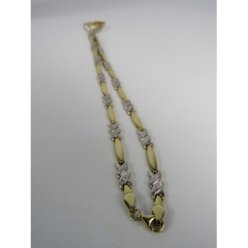 330 - 9ct gold yellow and white gold necklace with diamond cut panels, 17