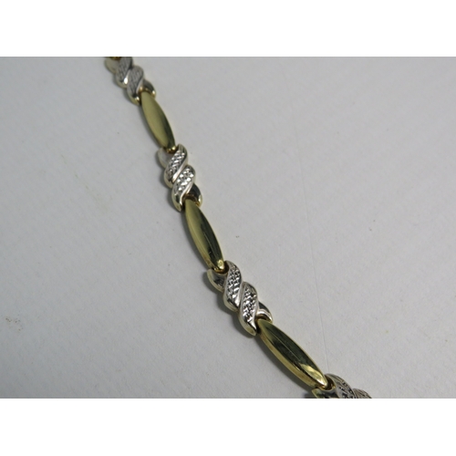 330 - 9ct gold yellow and white gold necklace with diamond cut panels, 17