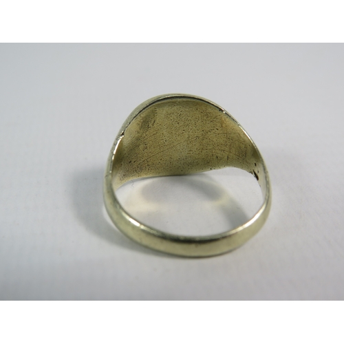 338 - White metal signet ring, finger size P. 7.7 grams