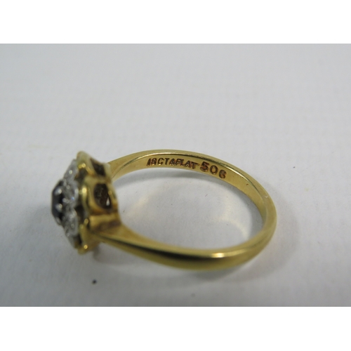 346 - 18ct gold ring set with a 4mm central sapphire and 8 diamonds in a platinum mount, finger size 