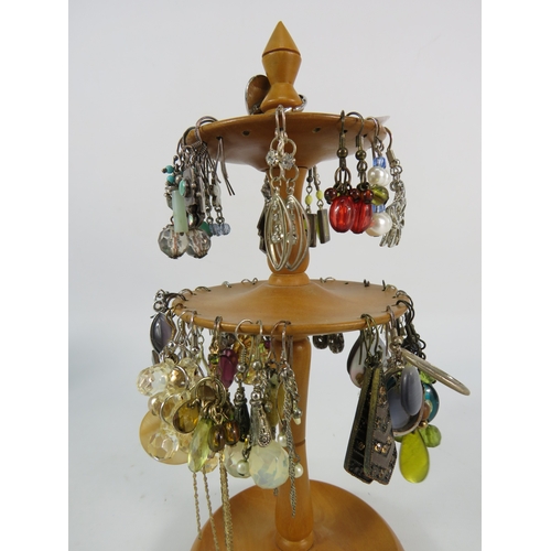 389 - Selection of Earrings including some sterling silver on a wooden display stand.