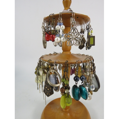 389 - Selection of Earrings including some sterling silver on a wooden display stand.