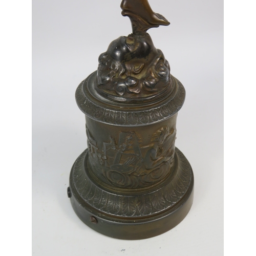 403 - A Bronze alloy figure of Hermes with a frosted glass flame shade, standing on a cherub decorated pli... 