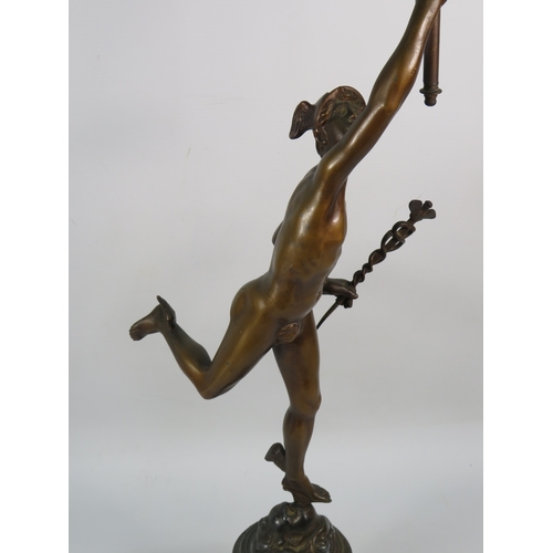 403 - A Bronze alloy figure of Hermes with a frosted glass flame shade, standing on a cherub decorated pli... 