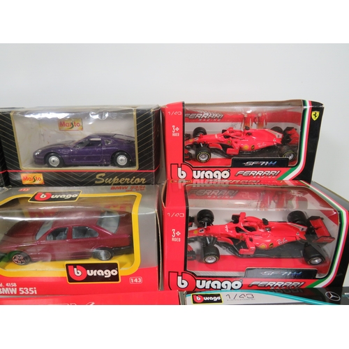 909 - Twelve 1:43 Scale Die Cast models by Maisto, Burago, Welly, Minichamps. All boxed and in unused cond... 