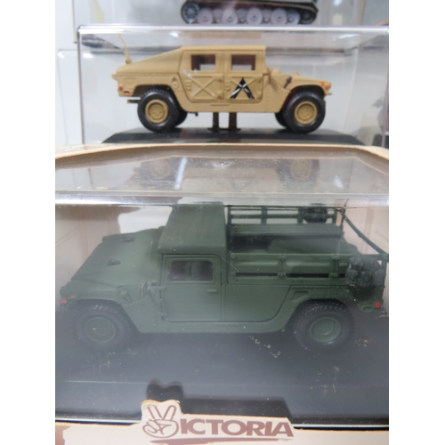 912 - Eight Die Cast Models of Military Armoured Vehicles, most set in perspex cases.  See photos