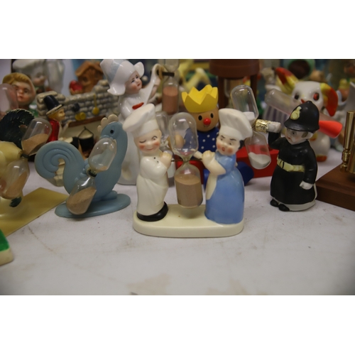 1207 - 40+ assorted Vintage Collectable Eggcups & Egg timers by various makers.  See photos.