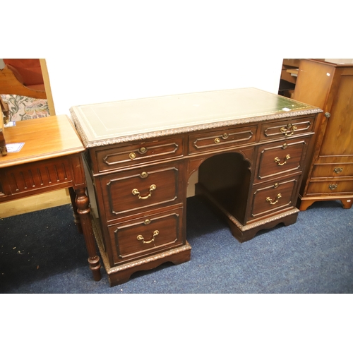 1225 - Leather topped kneehole desk which measures approx H:40 x W48 x D:20 inches   . Medial unit to one s... 