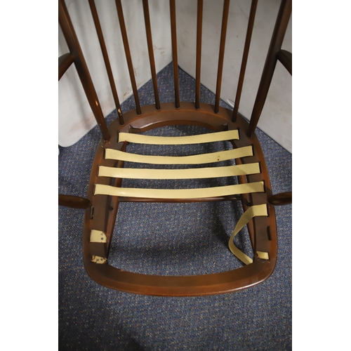 1233 - 1970's Era Ercol Windsor style Chair in golden Dawn Colour.  Some wear to arms and would need re-web... 