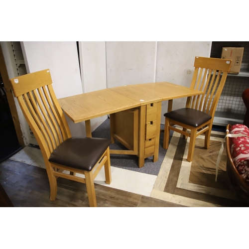 1235 - Solid Oak Dining room set comprising of a pair of upholstered chairs plus space saving table and sma... 