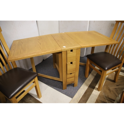 1235 - Solid Oak Dining room set comprising of a pair of upholstered chairs plus space saving table and sma... 