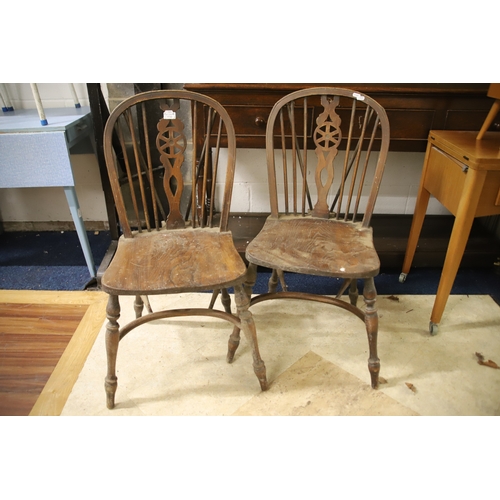 1259 - Two Vintage Wheelback chairs with Crinoline Stretcher. In as found condition and would benefit from ... 