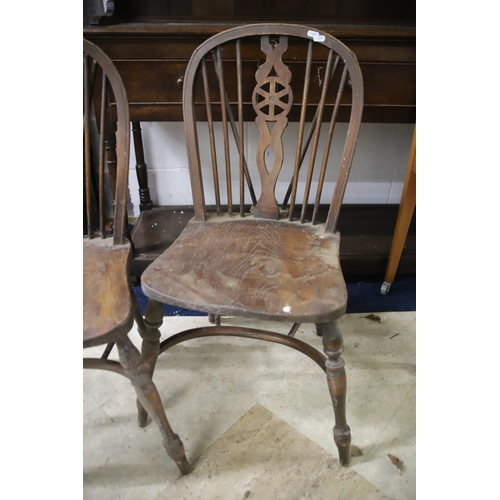 1259 - Two Vintage Wheelback chairs with Crinoline Stretcher. In as found condition and would benefit from ... 