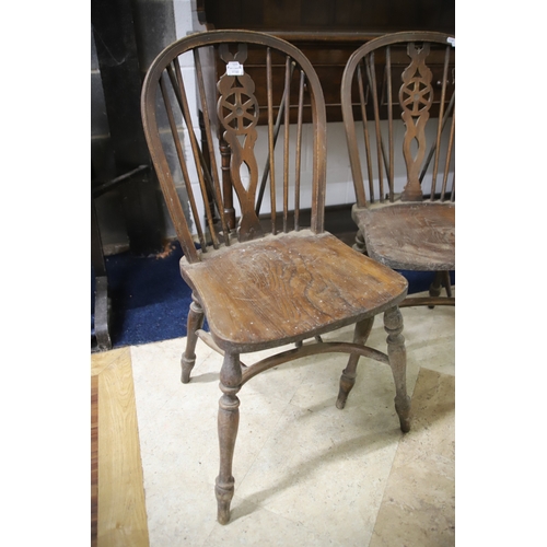 1259 - Two Vintage Wheelback chairs with Crinoline Stretcher. In as found condition and would benefit from ... 