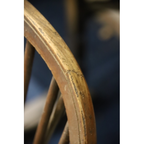 1259 - Two Vintage Wheelback chairs with Crinoline Stretcher. In as found condition and would benefit from ... 