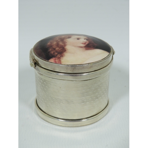 1001 - Hallmarked Sterling Silver Pill or Trinket box with hinged enamel set lid depicting a young woman wi... 