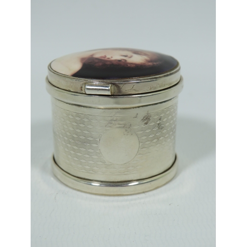 1001 - Hallmarked Sterling Silver Pill or Trinket box with hinged enamel set lid depicting a young woman wi... 