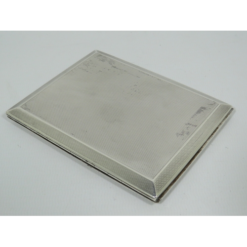 994 - Engine Turned Silver Cigarette case with UK Hallmarks to both segments.  In good order.  Total silve... 