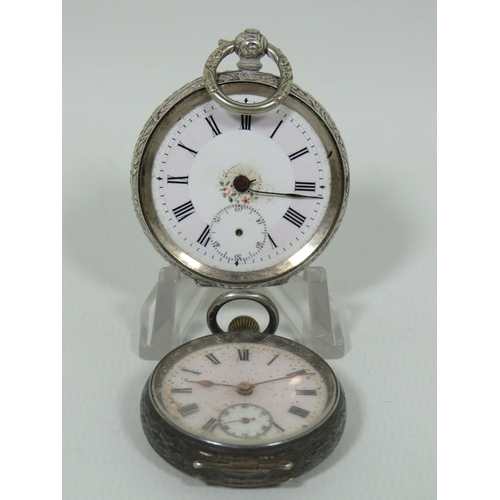 1011 - Two Silver Cased Pocket watches for spares or repairs. Larger watch is 0.800 Silver.  Smaller one is... 