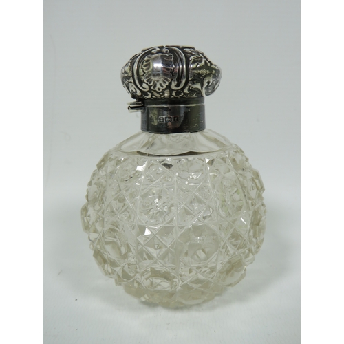 1018 - Silver Topped and Collared Hobnail Glass scent bottle, some dents to the lid.  Measures approx 4 inc... 