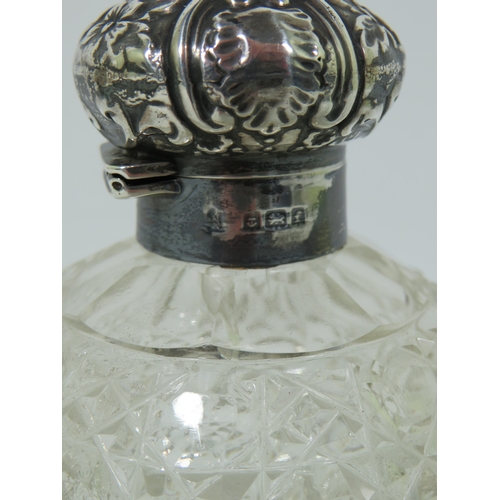 1018 - Silver Topped and Collared Hobnail Glass scent bottle, some dents to the lid.  Measures approx 4 inc... 