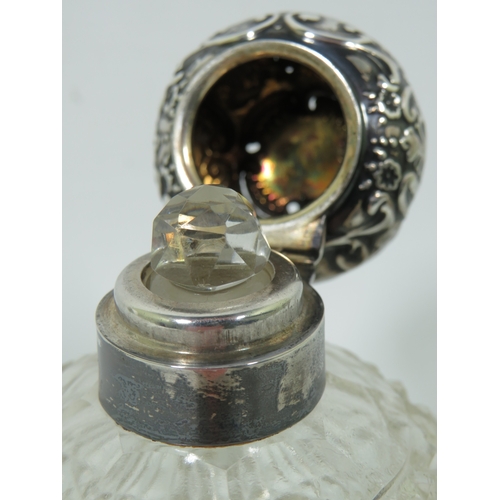 1018 - Silver Topped and Collared Hobnail Glass scent bottle, some dents to the lid.  Measures approx 4 inc... 