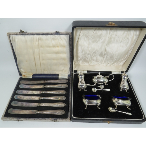 1024 - Boxed Vintage Silver Handled Butterknives plus a boxed Silver plated Cruet set. See photos