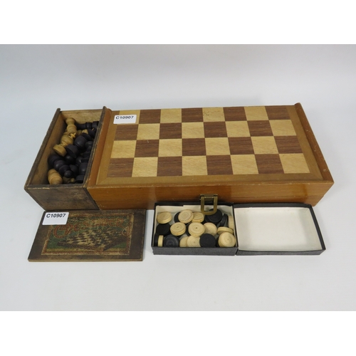 1494 - Two vintage chess sets, folding chess board and set of draughts.