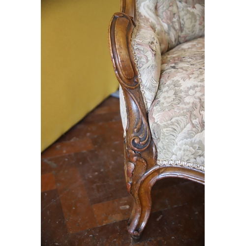 1388 - Nicely upholstered button back Walnut Victorian Armchair in good condition. Carved Detail to frame. ... 